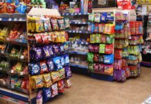 A store's confectionery section displaying a range of hanging bag sweet brands.