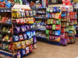 Inflation hits key Bank of England target A store's confectionery section displaying a range of hanging bag sweet brands.