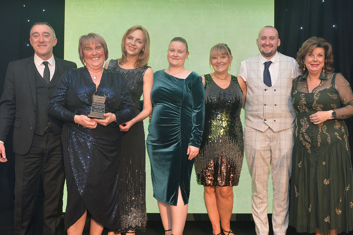 The Premier @ DUSA team accept the award for Sustainability Champion at the Scottish Grocer Awards with John Leslie of Britvic and Scots comedian Elaine C Smith.