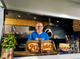 Galloway supports FareShare with grate project Gary McLean, Scotland's national chef, stands in a kitchen with a pizza in each hand with the pepperoni on the pizzas spelling out 90,000.