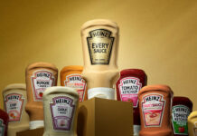 Bottles of Heinz sauce surround a single bottle of Heinz Saucy Sauce against a golden background.
