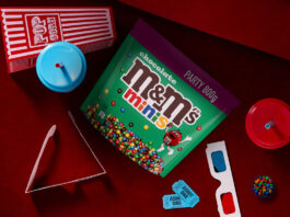 M&Ms goes big on fun in new Minis launch A packet of M&Ms Minis Party Size sits on a cinema seat with a popcorn box, juice cups, cinema tickets and 3D glasses around it.