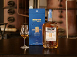 Mount Gay rum unveils new edition in Master Blender Collection A bottle of Mount Gay The Coffey Still Expression rum sits next to its blue packaging with a sniffing glass with the rum inside.