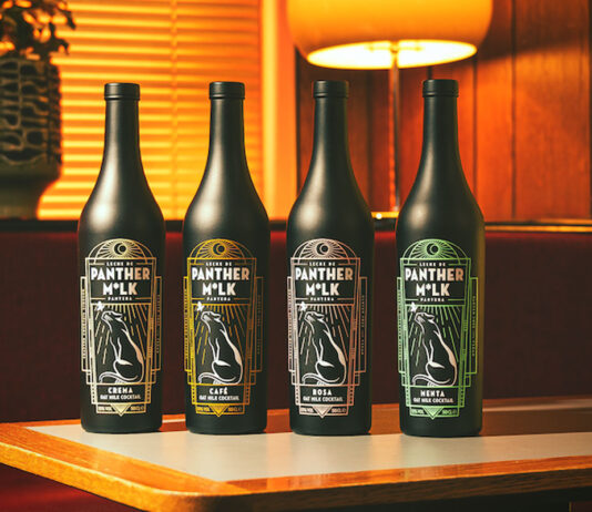 Lap up the cocktail opportunity with new Panther M*lk bottles Bottle of the newly designed Panther M*lk drink sit on top of a wooden table.