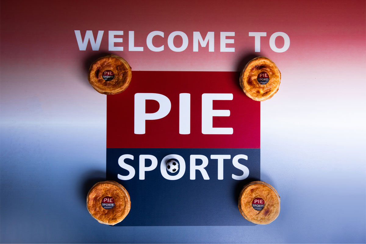 Promotional image of the Pie Sports logo with a pie in each corner of the logo.