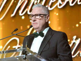 Tom Slaven announced as new president of SWA Tom Slaven, soon to be president of SWA, stands at a podium with a gold design behind him.