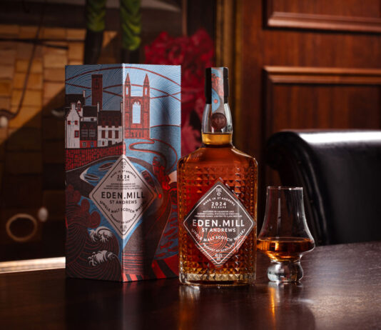 Eden Mill marks hometown pride in new whisky A bottle of Eden Mill Art of St Andrews whisky sits next to a nosing glass and the outer packaging for the dram on top of a wooden table.