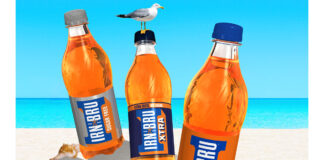 Promotional image for Irn-Bru's summer competition featuring bottles of Irn-Bru, Diet Irn-Bru and Irn-Bru XTRA on a beach.