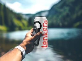 Lonkero to take UK market by storm A person holds a can of Lonkero with a blurred out lake in the background.