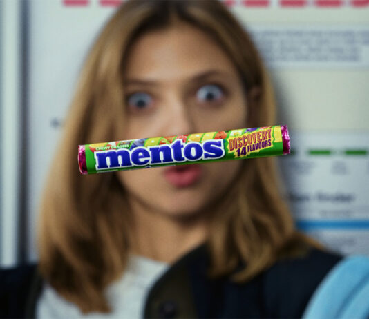 Mentos bolsters Discovery launch in new campaign A pack of Mentos Discovery floats in front of a woman's face who is interested in the sweet.