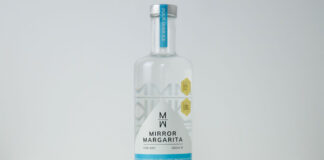 A bottle of Mirror Margarita stands against a white backdrop.