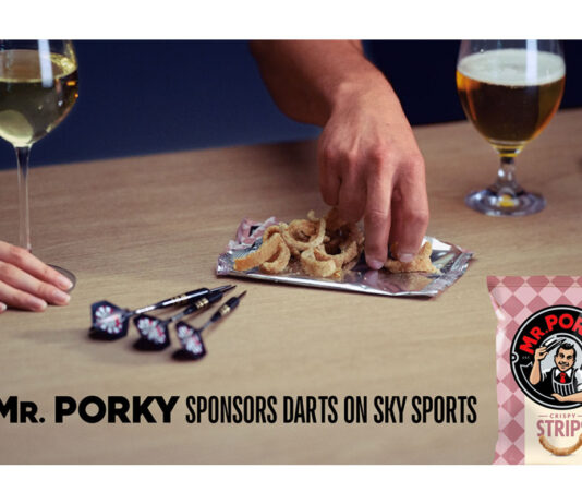 Tayto Group hits a bullseye in darts sponsorship on Sky Sports People pick from an open pack of Mr Porky pork scratchings with darts on the table and drinks around their hands, text reads "Mr. Porky sponsors Darts on Sky Sports".