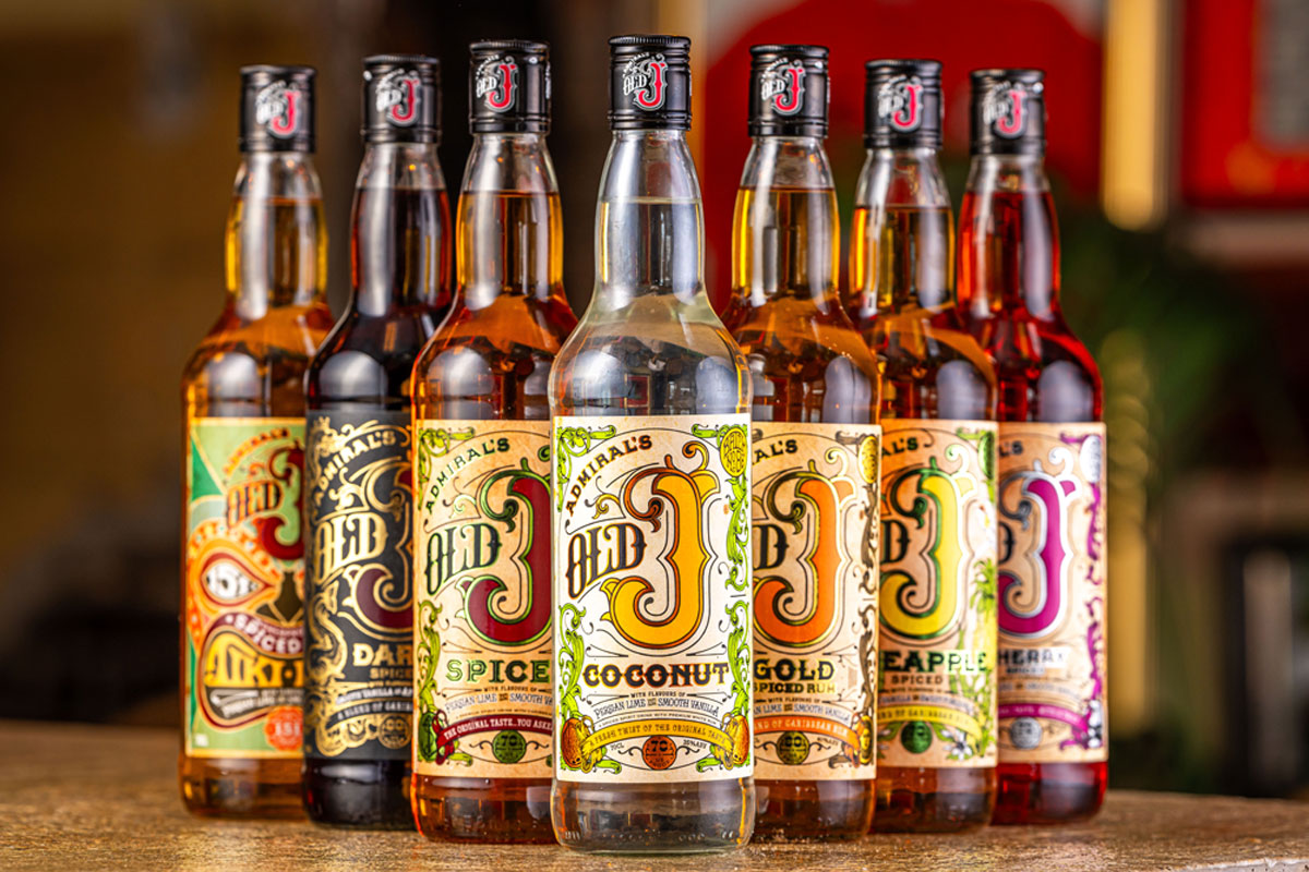 Bottles of Old J Rum range are lined up with a bar background.