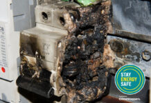 An energy meter that has been damaged by an electric fire after it has been tampered with.