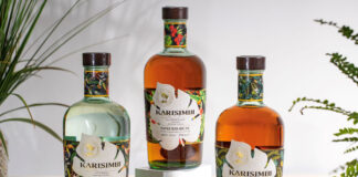 Karisimbi range of rums stand on a table with the Karisimbi White Rum, Golden Rum and Spiced Rum variants.