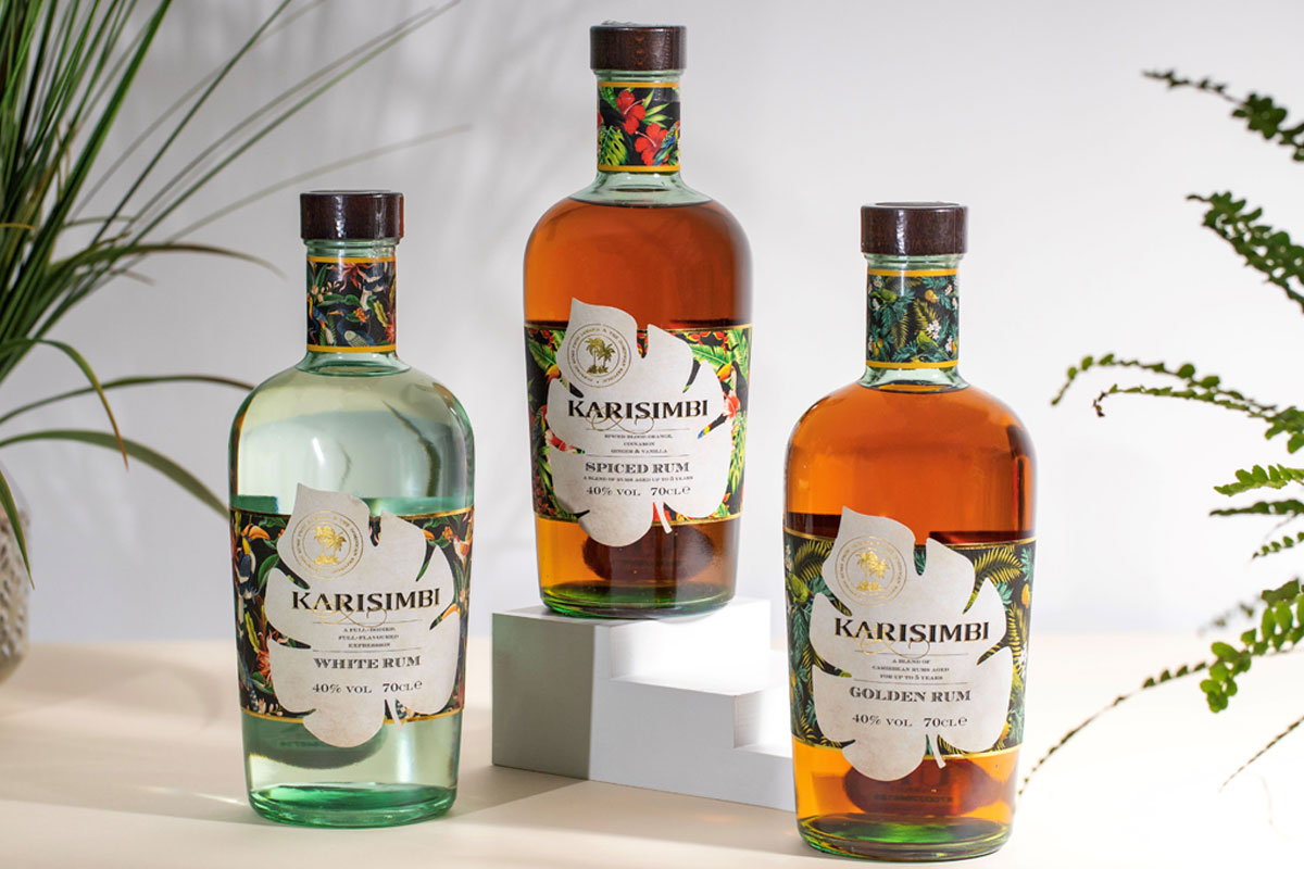 Karisimbi range of rums stand on a table with the Karisimbi White Rum, Golden Rum and Spiced Rum variants.