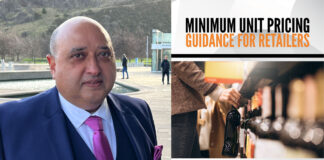 Pete Cheema, chief executive of the SGF stands outside Scottish Parliament with an image of the SGF Guide to MUP 2024 next to him.