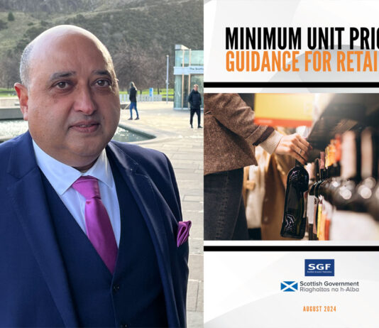 SGF publishes retailer guide to MUP Pete Cheema, chief executive of the SGF stands outside Scottish Parliament with an image of the SGF Guide to MUP 2024 next to him.