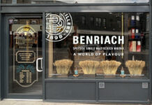 Store front of The Scottish Gantry store in Edinburgh with advertising for The Benriach single malt in the window.