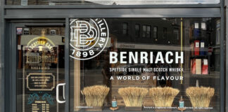 Store front of The Scottish Gantry store in Edinburgh with advertising for The Benriach single malt in the window.