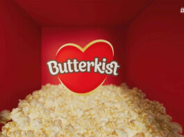 Butterkist pops on the small screen TV ad for Butterkist featuring a pile of popcorn in a red room with the Butterkist logo in the centre.