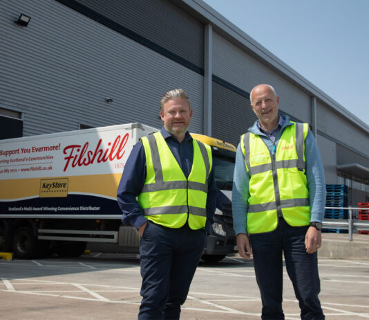 JW Filshill records strong financial results Simon Hannah, group chief executive officer at JW Filshill,(left) and Keith Geddes, chief financial and operating officer, (right) stand in front of the JW Filshill depot with one of the wholesaler's HGV vehicles behind them.