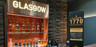 The Glasgow Distillery meeting room with a pack of Glasgow 1770 Tokaiji Cask Finish in front with a nosing glass next to it.