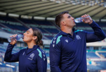 Rugby Union players Emma Wassell and Sam Skinner both drink from Highland Spring bottles in the middle of Murrayfield Stadium.