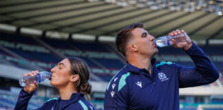 Rugby Union players Emma Wassell and Sam Skinner both drink from Highland Spring bottles in the middle of Murrayfield Stadium.