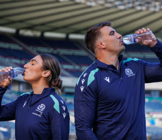 Highland Spring champions Scottish Rugby Rugby Union players Emma Wassell and Sam Skinner both drink from Highland Spring bottles in the middle of Murrayfield Stadium.