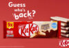 Promo of the return of KitKat Cookies & Cream two finger biscuits, with a pack shot of the multipack and unwrapped KitKat Cookies & Cream biscuits to the side against a red background. The text reads "Guess who's back?".