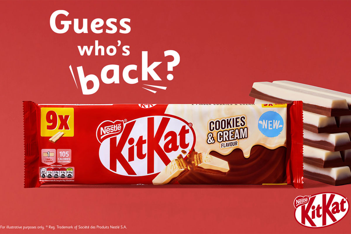 Promo of the return of KitKat Cookies & Cream two finger biscuits, with a pack shot of the multipack and unwrapped KitKat Cookies & Cream biscuits to the side against a red background. The text reads "Guess who's back?".