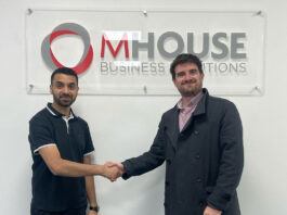 MHouse ties up with Volumatic to streamline the process Faisal Sattar, chief exec at MHouse, and Tom Walker, Volumatic's Scotland Account manager. shake hands in front of the MHouse logo.
