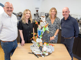 Matthew Algie marks landmark 160th anniversary (left to right) Robert Milne, Rosluyn Coombe, Estelle MacGilp and Paul Chadderton all stand in a kitchen at a table with the 160th anniversary Matthew Algie cake.