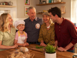OXO is back on TV for the autumn A family gather round a kitchen table together looking happy, still image taken from OXO TV advert.