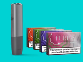 Philip Morris expands on Terea range An IQOS ILUMA device with packs of Terea Pearls heat sticks against a teal blue background.
