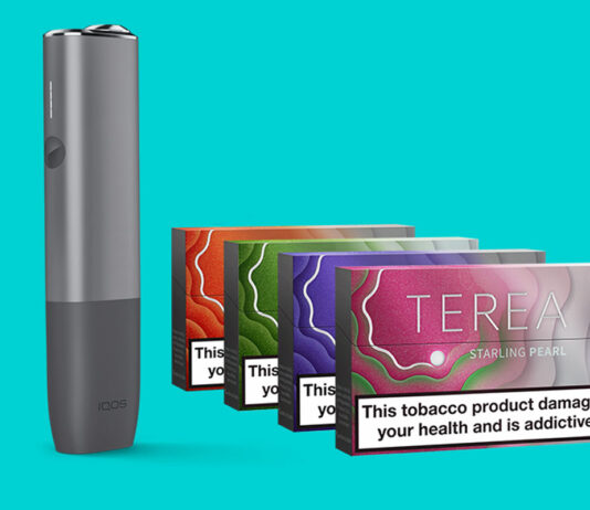 Philip Morris expands on Terea range An IQOS ILUMA device with packs of Terea Pearls heat sticks against a teal blue background.