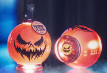 Lifestyle image of Gravity Drinks Pumpkin Potion featuring two of the liqueurs, one of which is on its side.