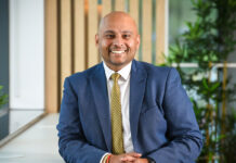 Tarajit Singh Dhillon, head of retail at Nisa, sits at a desk.