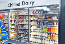 A chiller space in a convenience store stocking chilled dairy products.