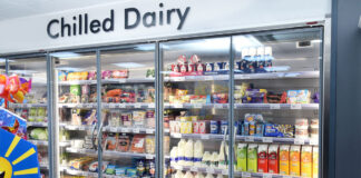 A chiller space in a convenience store stocking chilled dairy products.