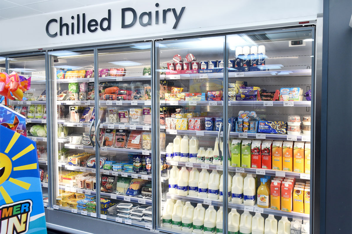 A chiller space in a convenience store stocking chilled dairy products.