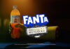 Advert for Fanta Beetlejuice Beetlejuice advert with a ghoulish hand holding a bottle of Fanta Zero with the Fanta logo and Beetlejuice Beetlejuice logo in front of the hand.