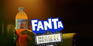 Advert for Fanta Beetlejuice Beetlejuice advert with a ghoulish hand holding a bottle of Fanta Zero with the Fanta logo and Beetlejuice Beetlejuice logo in front of the hand.