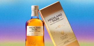 A bottle of the new look for Highland Park stands next to the new packaging design for the box with a colour gradient background.