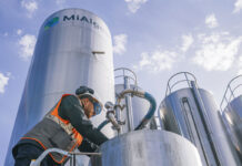 A person working at a silo at the MiAlgae production facility.