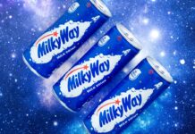 Promotional image of Mily Way Milk Drinks cans with three of the cans against a starry background.