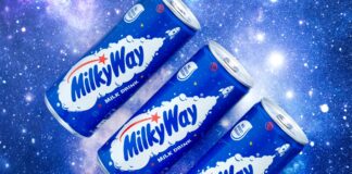 Promotional image of Mily Way Milk Drinks cans with three of the cans against a starry background.