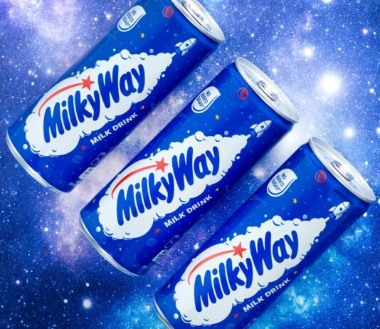 Milky Way expands in milk drinks Promotional image of Mily Way Milk Drinks cans with three of the cans against a starry background.