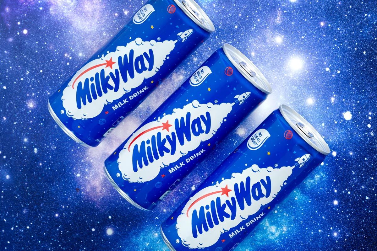 Promotional image of Mily Way Milk Drinks cans with three of the cans against a starry background.